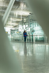 Young woman with backpack walking through the airport