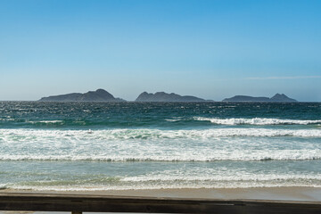 Vigo beach, Spain, with the Cies Islands visible in the background from the Spanish peninsula. A beautiful view of the mainland and the islands.