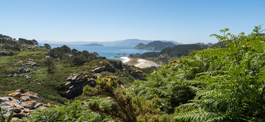 Highest mountain on the Cies Islands, Vigo, Spain. Views of white sandy beaches with a large green forest area.