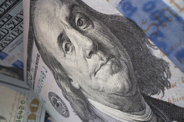 Close-up of Benjamin Franklin on a 100 dollar banknote.