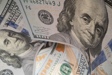 Close-up of Benjamin Franklin on a 100 dollar banknote.