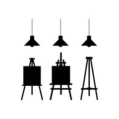 Three black silhouette easels and three hanging pendant lamps artist studio