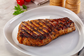 Grilled pork steak with bone