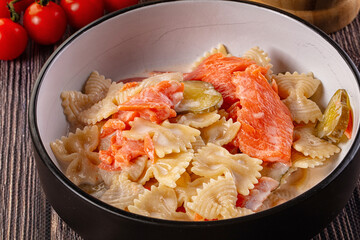 Italian pasta farfalle with salmon