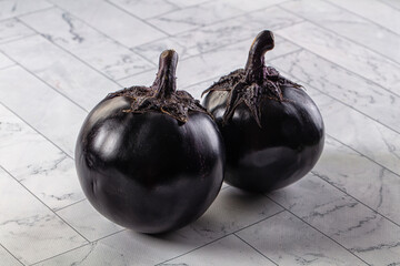 Raw round black big eggplant