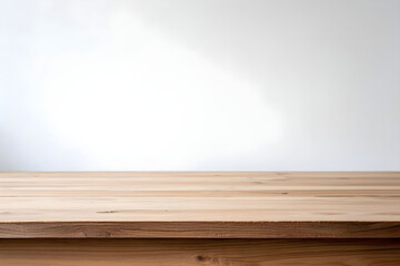 Clean, natural wood table surface with bright white background for product display and advertising