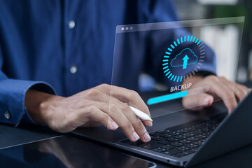 Backup storage data, business data cloud backup, digital data storage and connection service. Person using laptop with online cloud backup.