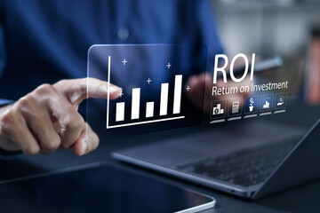 ROI, Return on Investment concept. financial strategies, marketing plan, and efficiency. business strategy for investment. Businessman using laptop with ROI icons on virtual screen.