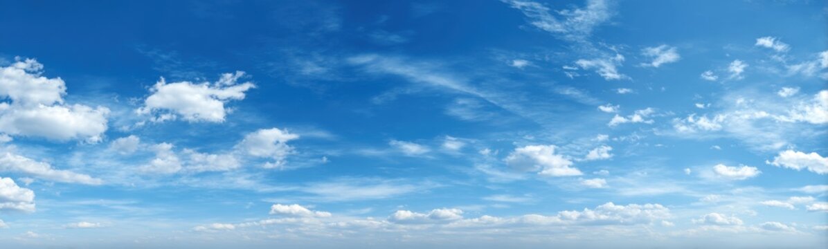 Wide shot of a partly cloudy, vibrant blue sky (2)