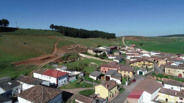 Church of San Juan Bautista in Nogales de Pisuerga, Palencia, with cemetery and hillside
