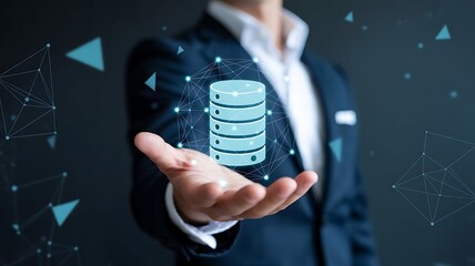 Businessman-holding-database-icon-representing-data-storage-networking