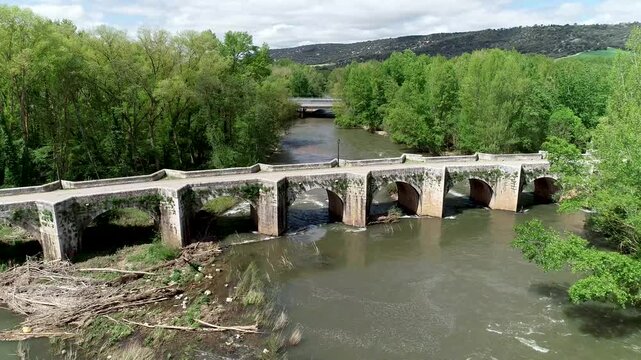 Aerial view of Renaissance stone bridge over Arlanza River in Quintana del Puente