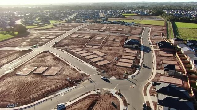 Aerial View of New Residential Development Under Construction with Roads and Empty Lots.