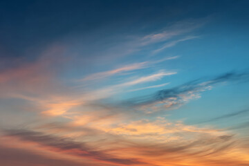 Ethereal Twilight Canvas: Soft Clouds Drifting Across a Fiery Gradient Sky