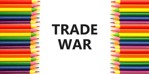 Trade war symbol. Concept word Trade war on beautiful white paper. Colored pencils. Beautiful white...