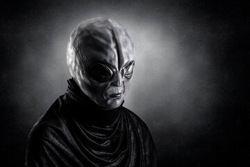 Mysterious humanoid alien at night over dark misty background