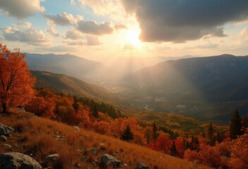 Fototapeta premium Breathtaking Autumn Landscape with Sunlight Streaming Through Clouds Over Mountain Valley