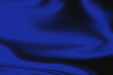 Closeup of flowing blue fabric with soft folds and shadows, creating a luxurious and dynamic background