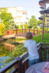 Happy european family, visting Hoi An city in Vietnam for a summer vacation, trying traditional food na watching the show in Memories Land