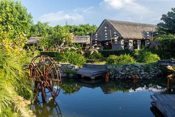 Happy european family, visting Hoi An city in Vietnam for a summer vacation, trying traditional food na watching the show in Memories Land