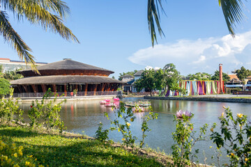 Happy european family, visting Hoi An city in Vietnam for a summer vacation, trying traditional food na watching the show in Memories Land