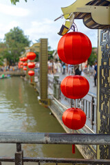 Happy european family, visting Hoi An city in Vietnam for a summer vacation, trying traditional food na watching the show in Memories Land