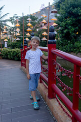 Happy european family, visting Hoi An city in Vietnam for a summer vacation, trying traditional food na watching the show in Memories Land