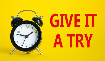 Give it a try symbol. Beautiful yellow background with alarm clock. Business and Give it a try...