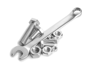 Metal wrench, bolts and nuts isolated on white
