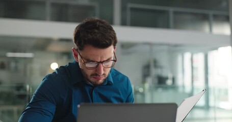 Business, man and reading document in office for accounting, finance report and company budget. Male person, laptop and paperwork for financial comparison, funding information and investment proposal - Powered by Adobe