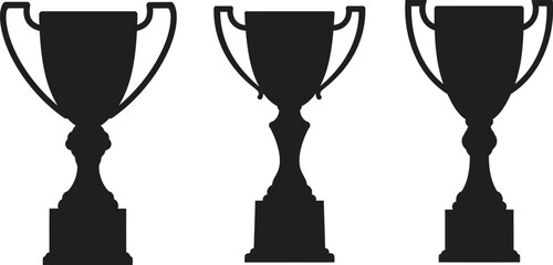 three elegant trophies standing side by side in silhouette