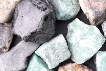 Different healing stones on table, top view