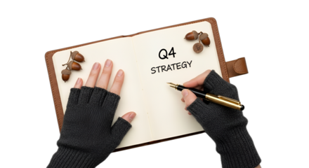 Q4 business strategy planning on a notepad with hands in gloves and acorns, perfect for year-end goals, autumn marketing campaigns, financial reports, or blog posts,