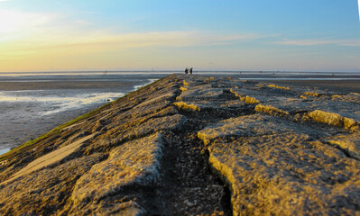 View of the Wadden Sea at Sunset from a Stone Pier