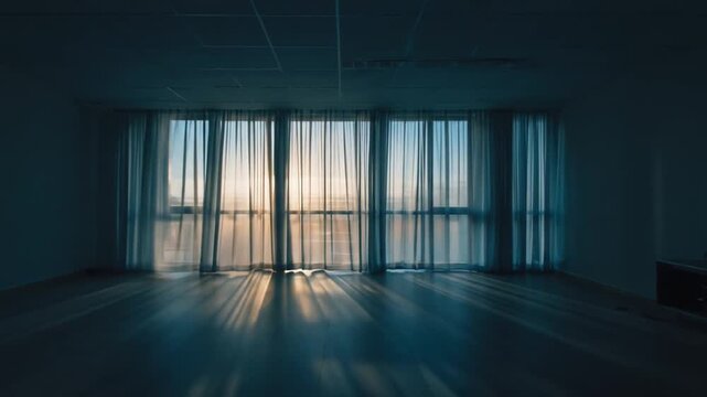 Serene sunrise view through sheer curtains in a modern, empty room with soft lighting