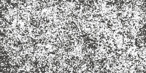 Textured black and white stone wall pattern with a seamless grey granite surface for a cold, natural background design