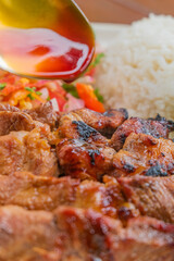 Delicious grilled meat with rice and fresh salad, ready to eat, perfect for food marketing