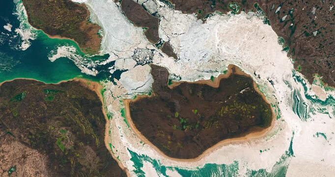 Aerial perspective on  ice in sea waters near coast. Cold water concept. Camera is zooming in. Animation based on image by NASA