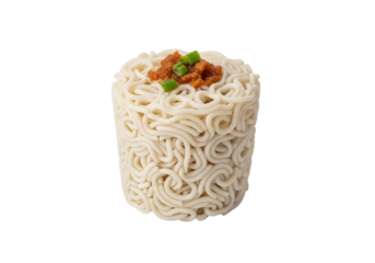 A close-up view of a cylindrical mound of uncooked noodles, topped with a savory sauce and chopped green onions.