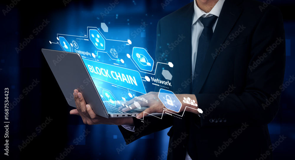 Poster a businessman in a suit holds a laptop featuring an overlay of blockchain graphics to illustrate the