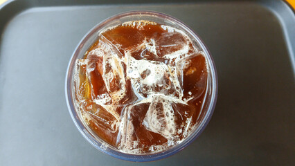 A cup of iced coffee on a table