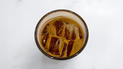 A cup of iced coffee on a table