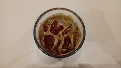 A cup of iced coffee on a table