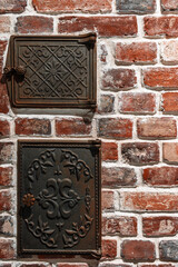 Vertical shot with loft style design, cast iron inspection hatches for checking devices on brick wall, vintage style design concept with copy space