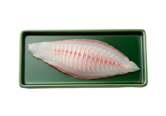 A fresh fish fillet, displayed artfully on a dark green tray, showcasing its delicate white flesh and vibrant pink lines.