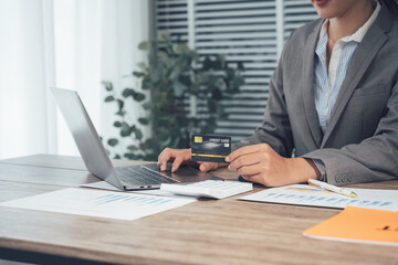 Digital Transactions: A professional woman engaged in online shopping or financial activity, focusing on secure transactions.