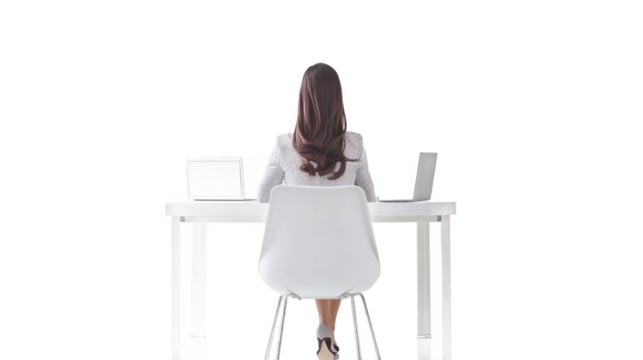 Rear view of a businesswoman in a minimalist white office workspace