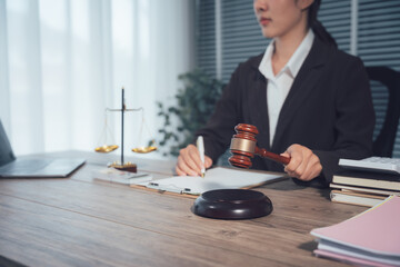 Legal Proceedings: A legal professional, equipped with a gavel and poised to deliver a verdict, diligently reviews documents in a setting imbued with the solemnity of justice.