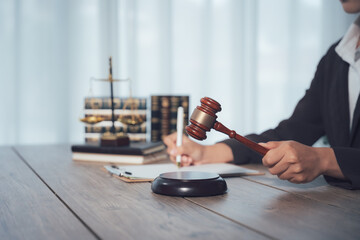 Judge gavel with Justice lawyers, Businessman in suit or lawyer working on a documents. Legal law, advice and justice concept.