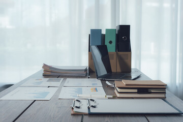 Business Documents and Laptop on Desk